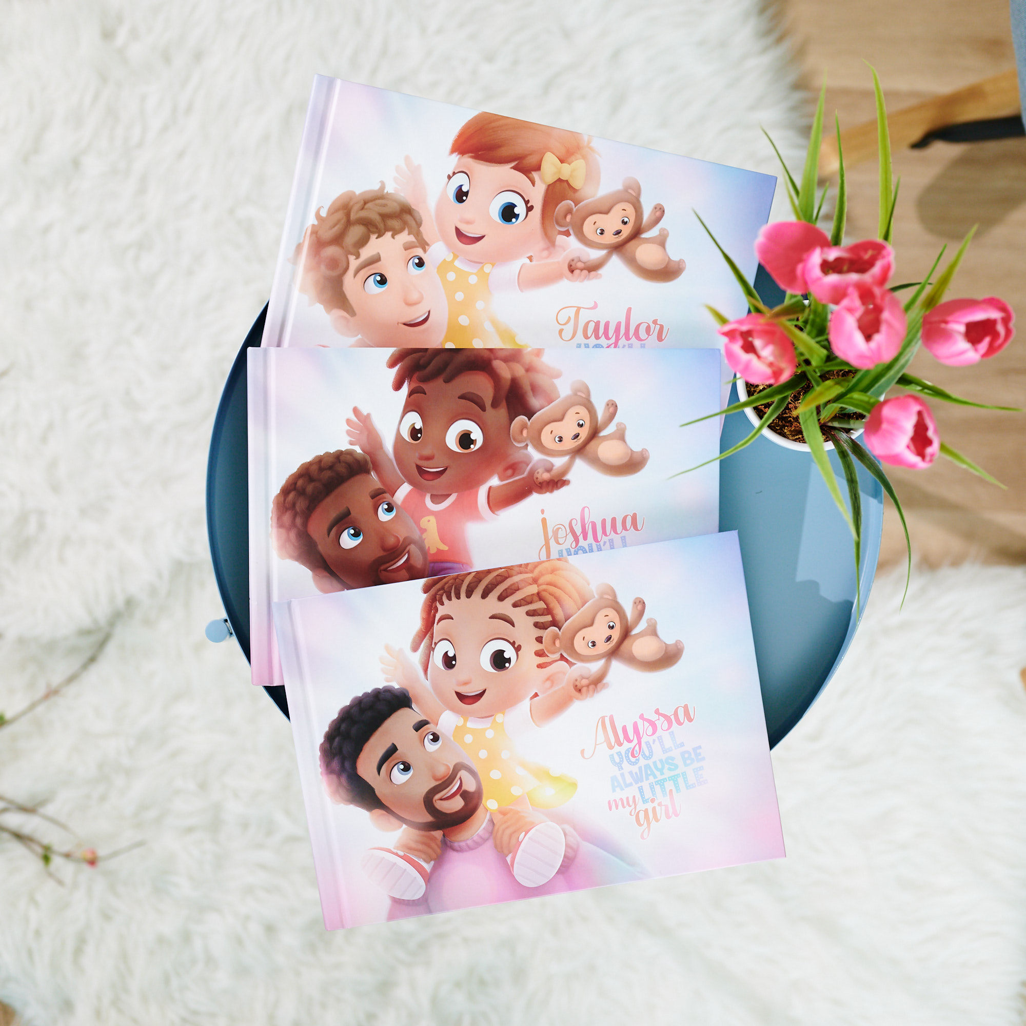 Three best-selling "Always Little" Books from Hooray Heroes lined up on a table.